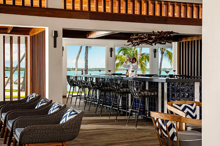 la terrasse bar with bartender at le saint geran hotel mauritius