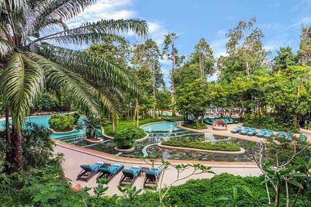 Landscaped-swimming-pool-with-sun-beds-at-the-andaman-hotel-malaysia