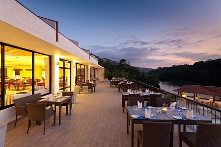 dining terace overlooking the river at cinnamon citadel kandy hotel sri lanka