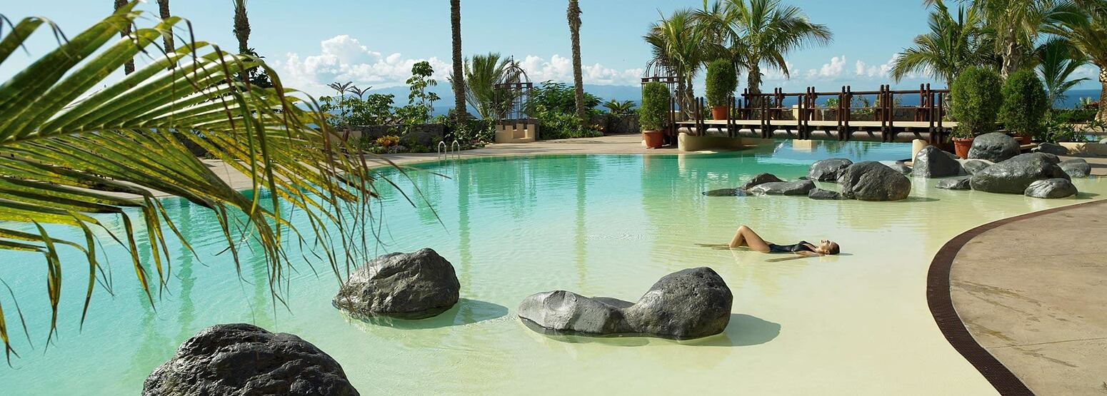 Main pool with palms at Abama Golf and Spa Resort Tenerife