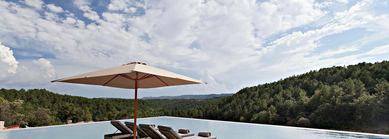 Stunning views across the forest from the pool at la Vella Farga Spain