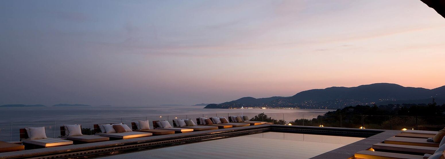 Sunset view across the pool and sea at Lily of the Valley France