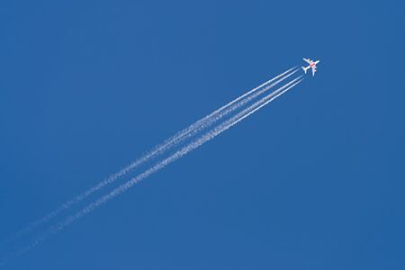 Open sky with flight and trail