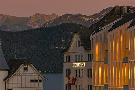 Chenot Palace Weggis Switzerland Hotel and mountains at sunset Header